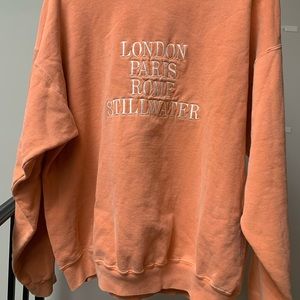 Oversized pastel orange pullover sweater